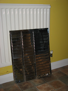 Novitherm Reflective panels - inserted between the radiators and the external wall to reflect heat into the room and away from the colder external wall
